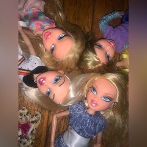 4 Brats dolls with clothes, bratz shoes and 2 doll body parts for refurnishing